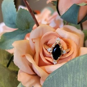 Yellow 10k gold black onyx and lab grown diamonds.